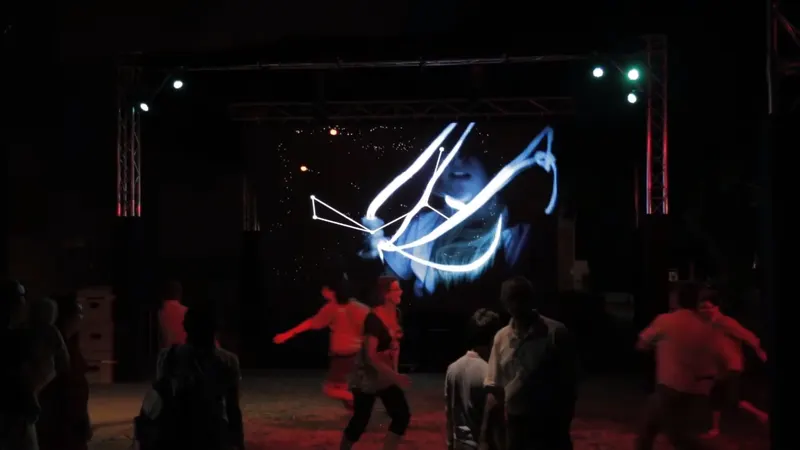 Encounters installation with audience members interacting with projected visuals